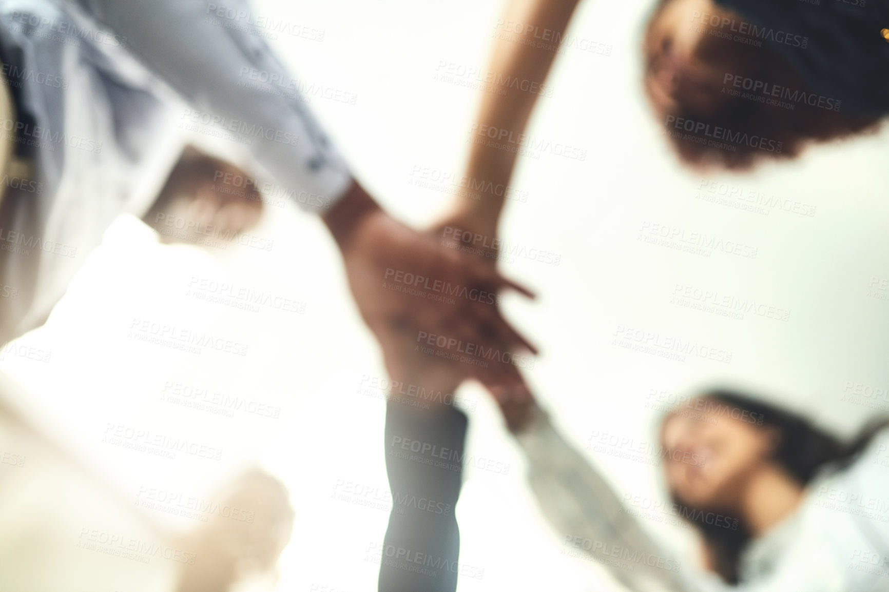 Buy stock photo Business people, blur and stack of hands in office, team building and support in project. Employees, closeup and together in solidarity for company growth, low angle and united in workplace mission