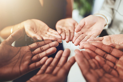 Buy stock photo Closeup shot of a group of businesspeople standing with their hands cupped together