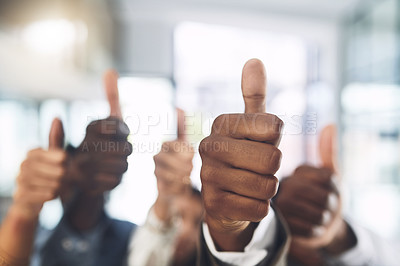 Buy stock photo Closeup shot of a group of businesspeople showing thumbs up in an office