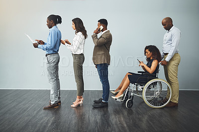 Buy stock photo Business people, interview and line with tech, inclusion and recruitment for hiring. Wheelchair, social media with opportunity and person with disability in waiting room for affirmative action