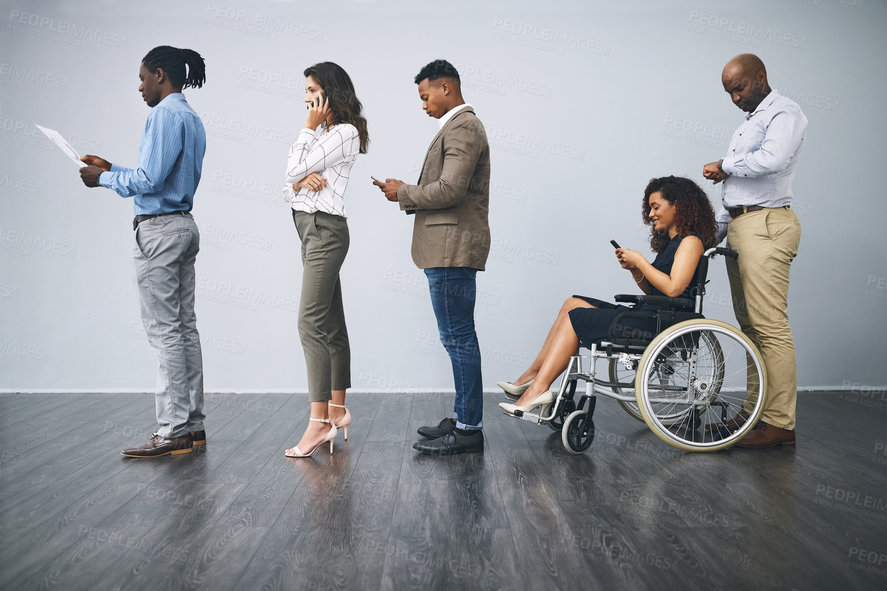 Buy stock photo Business people, interview and work line with tech, inclusion and recruitment for office hiring. Wheelchair, staff and social media with opportunity and person with disability in waiting room