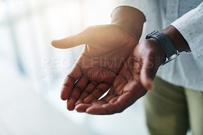 Buy stock photo Closeup shot of an unrecognizable businessman standing with his hands cupped together