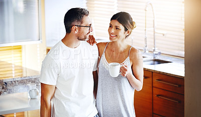 Buy stock photo Love, coffee and couple hug in a kitchen for morning, conversation and bonding at home together. Marriage, trust and people embrace with tea in house for speaking, security and romance on weekend