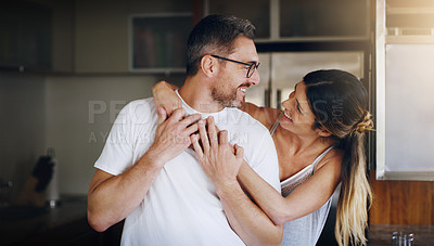 Buy stock photo Love, hug and happy couple in home together with care, kindness and support in morning. Marriage, man and woman in romantic embrace with smile, connection and security in relationship in apartment