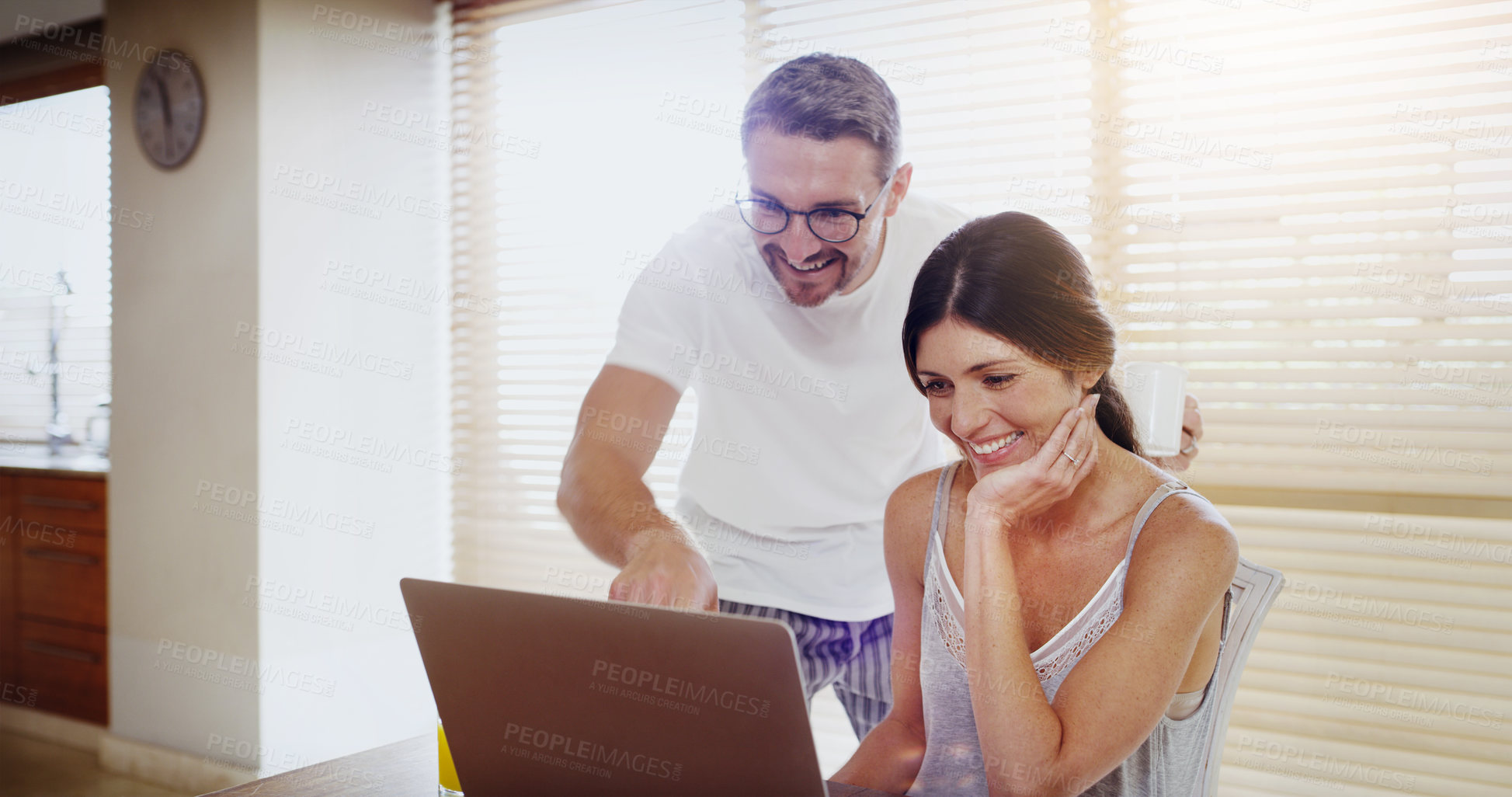 Buy stock photo Shot of a mature couple using a laptop together at home