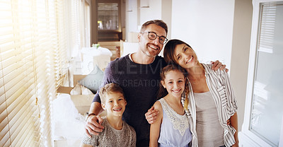 Buy stock photo Portrait of a happy family together in their new home
