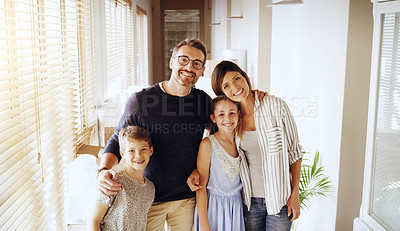 Buy stock photo Real estate, portrait and happy family in new house with love, care or future security while bonding. Property, mortgage or kids hug parents in dream home for moving, relocation or investment success