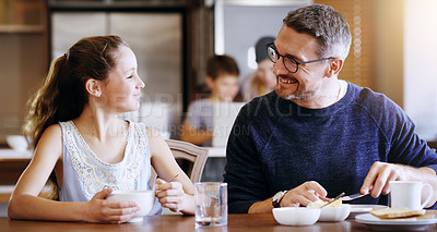 Buy stock photo Happy father, morning and breakfast with daughter at home for nutrition, vitamins or light snack to start day. Dad with smile for healthy meal, food or cereal with child, kid or girl on dining table