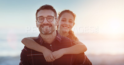 Buy stock photo Portrait of a father piggybacking his daughter outdoors