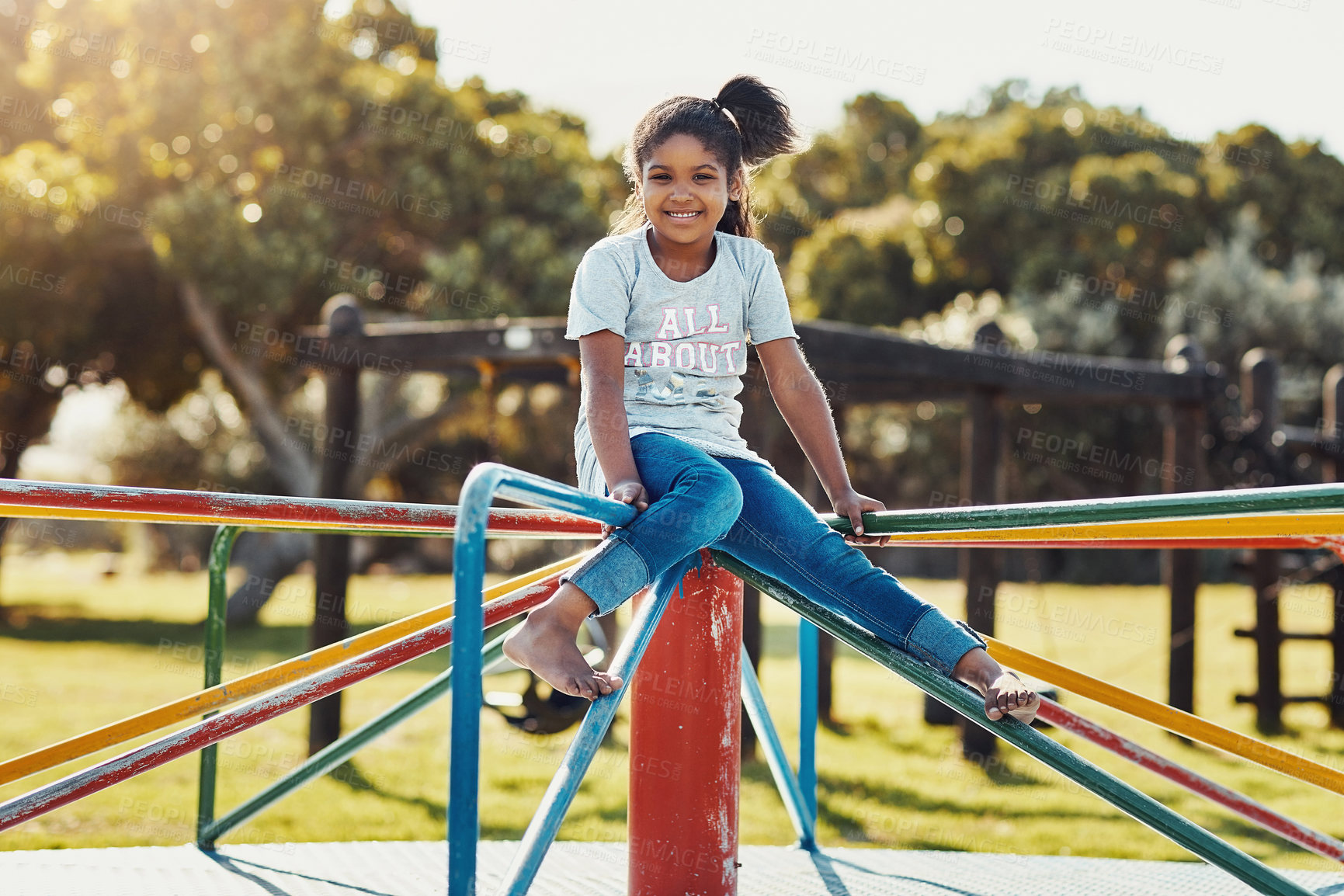 Buy stock photo Full length Portrait of an adorable little girl playing on a merry-go-round at the park