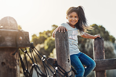 Buy stock photo Cropped portrait of an adorable little girl enjoying some time outdoors