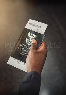 Buy stock photo POV shot of an unrecognizable man holding his passport and boarding pass in an airport