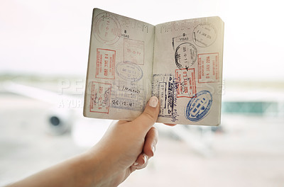 Buy stock photo POV shot of an unrecognizable woman holding a passport indoors