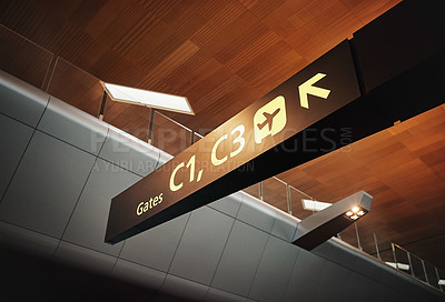 Buy stock photo Empty, airport and signage with direction for departure, arrival or boarding guide on international flight at travel station. Interior, label or billboard sign for gates, terminal or transportation