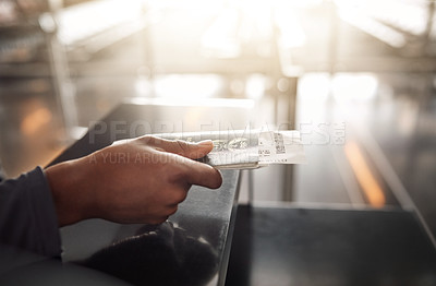 Buy stock photo Cropped shot of an unrecognizable man handing over his ID book at a boarding gate in an airport