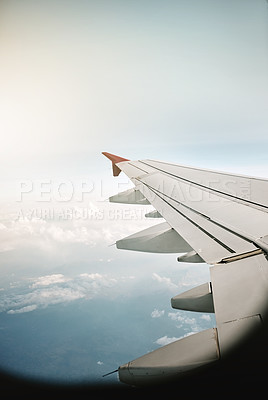 Buy stock photo Airplane, wing and blue sky with clouds for flight, travel or international transportation. Aircraft, jet or turbines with window view on aeroplane of natural atmosphere, motion or aerodynamics