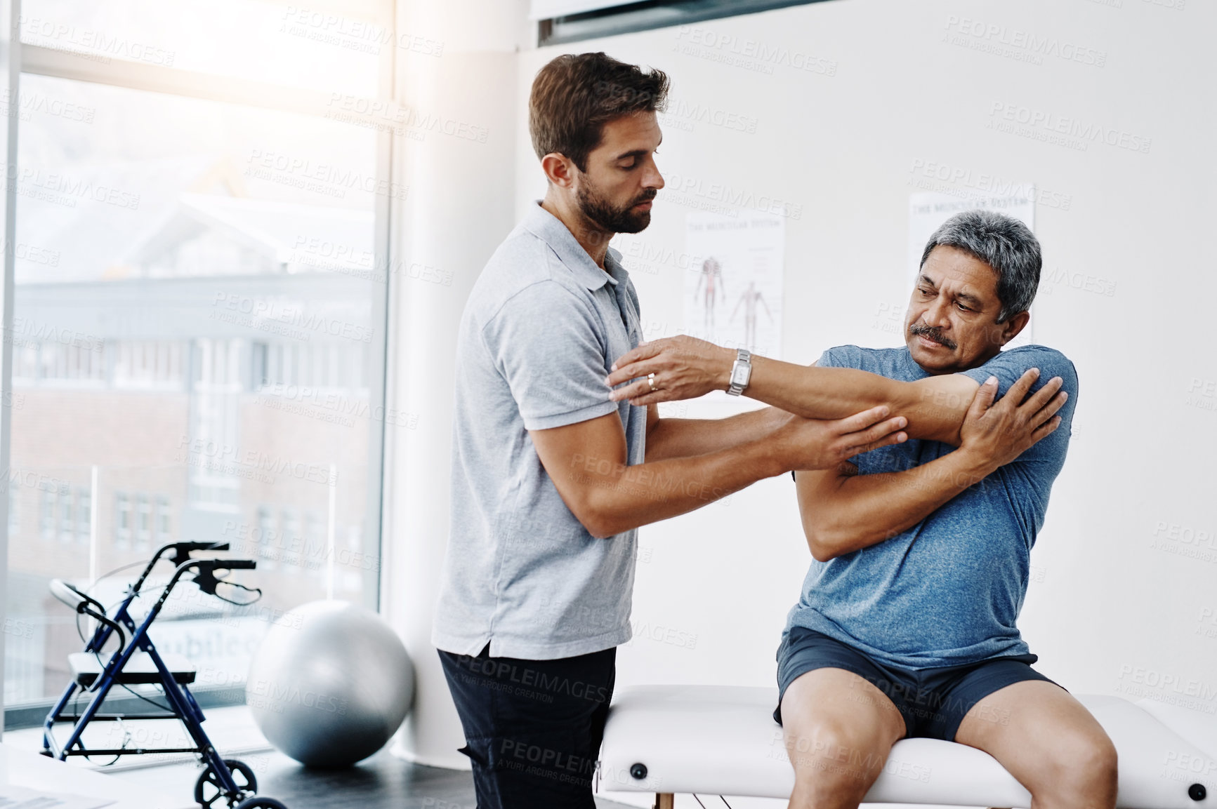 Buy stock photo Healthcare, stretching and mature man in clinic, helping and physiotherapist for exercise and fitness. Hospital, workout and physiotherapy of patient, rehabilitation and concentration of person