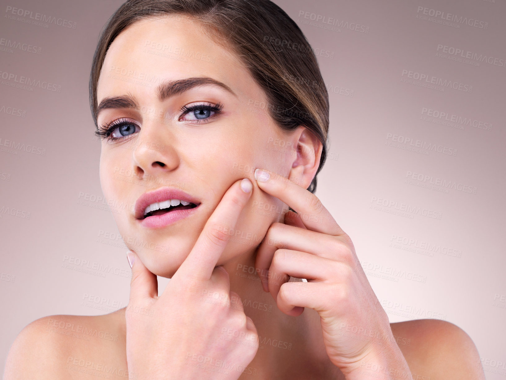 Buy stock photo Studio portrait of a beautiful young woman posing against a pink background