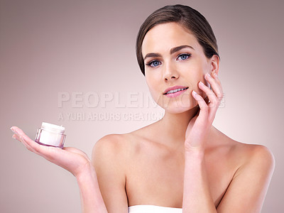 Buy stock photo Face cream, woman and portrait in studio pink background for skincare, cosmetics and wellness. Female person, beauty product and confident with glow for health or dermatology isolated on backdrop