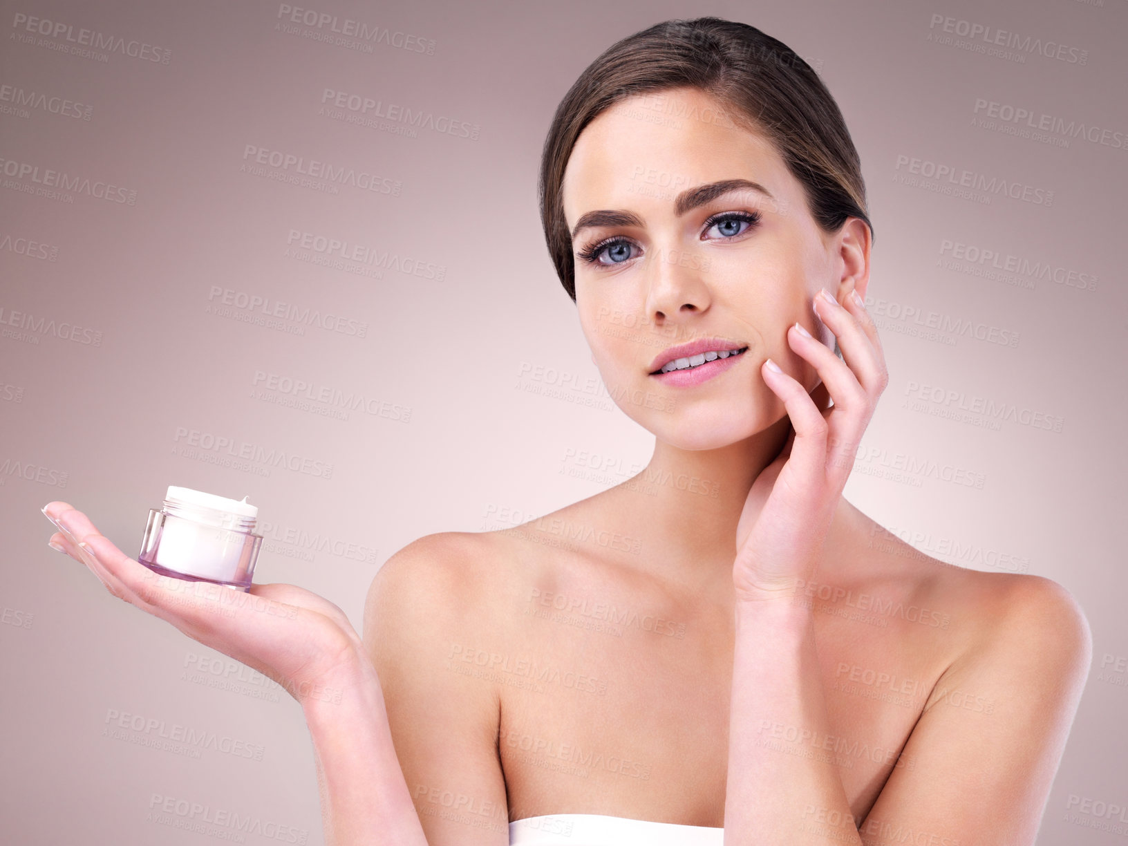 Buy stock photo Face cream, woman and portrait in studio pink background for skincare, cosmetics and wellness. Female person, beauty product and confident with glow for health or dermatology isolated on backdrop