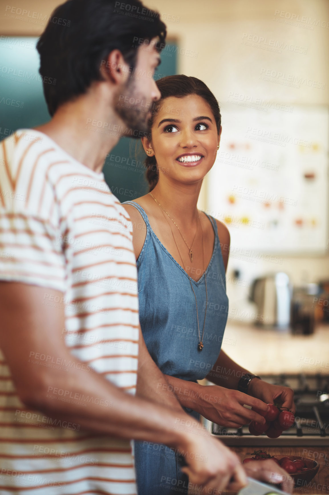 Buy stock photo Cooking, love and couple in kitchen, smile and romance for anniversary in house, date and together in morning. Commitment, man and woman with food, peace and people in home, happy and calm in weekend