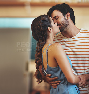 Buy stock photo Love, kiss and couple in kitchen, hug and romance for anniversary in house, date and together in morning. Commitment, man and woman with embrace, peace and people in home, happy and calm in weekend