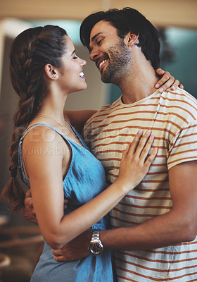 Buy stock photo Happy, couple and romance with hug in house, bonding and smile in kitchen, morning and relax in weekend. Home, man and woman with embrace, anniversary and people in date, break and together for love