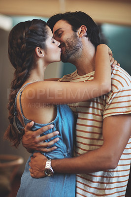 Buy stock photo Kiss, hug and couple in house, romance and passion for anniversary in kitchen, date and together in morning. Commitment, man and woman with embrace, peace and people in home, happy or calm in weekend