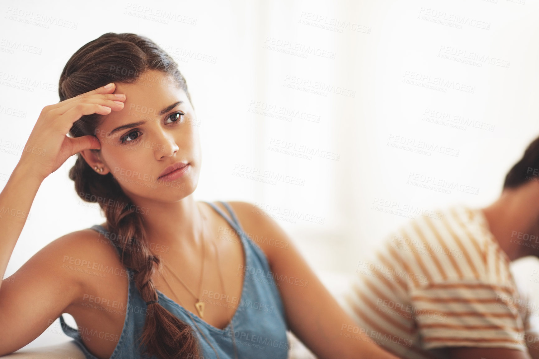 Buy stock photo Unhappy, conflict or sad with a couple fighting on a sofa in their home living room about an affair or breakup. Depression, abuse or domestic violence with a woman thinking of breakup while arguing