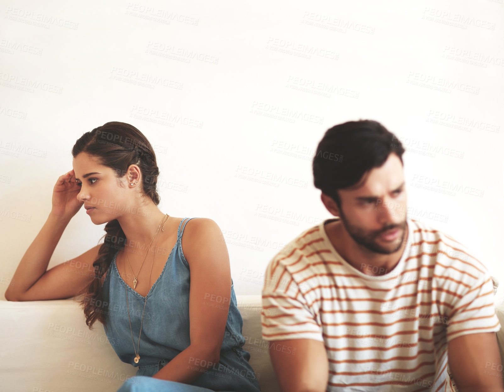 Buy stock photo Couple, frustrated and fight in living room for problem, marriage conflict and relationship drama in house. Man, woman and angry on sofa for cheating, argument and trust issues in home with divorce