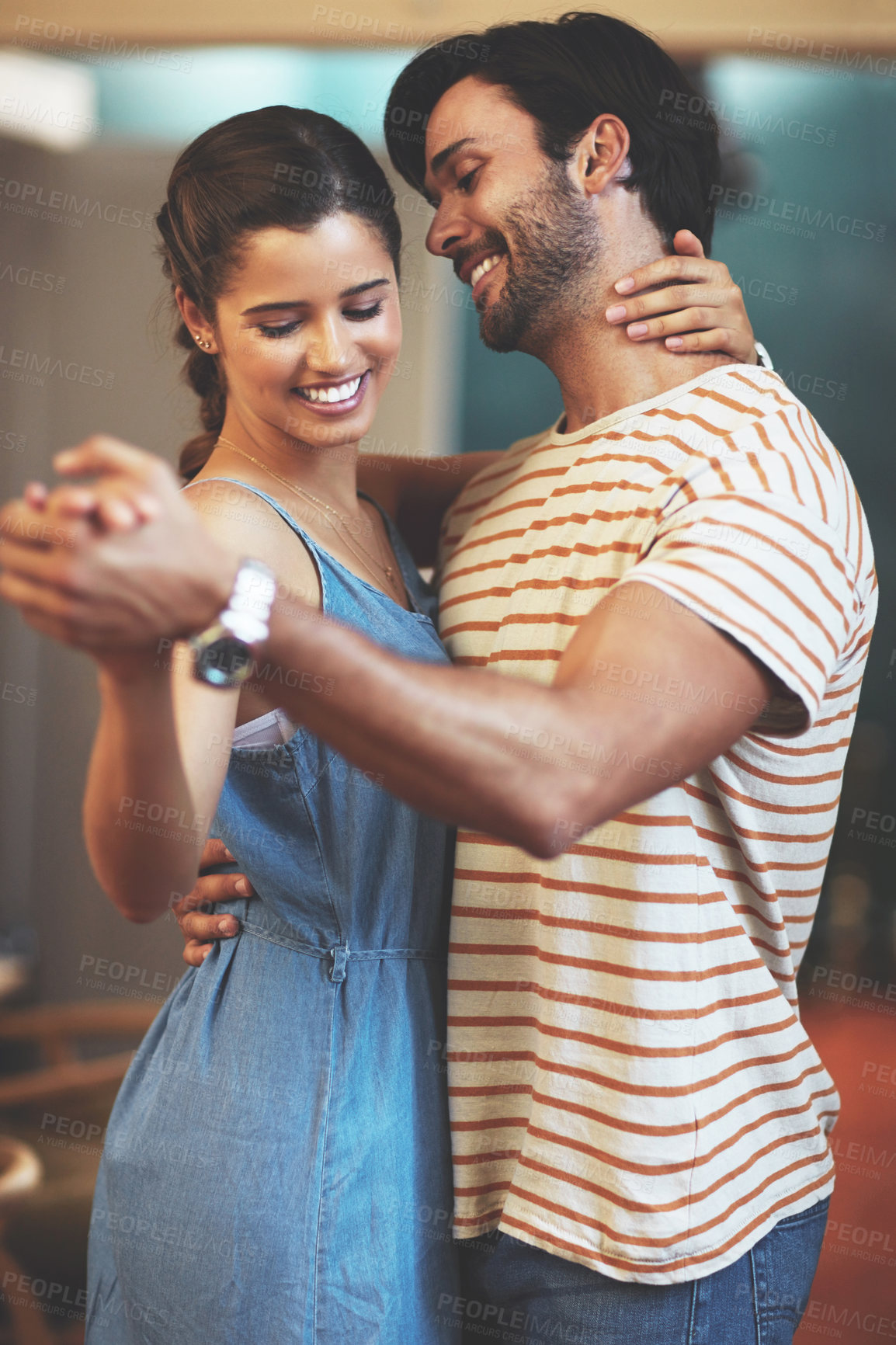 Buy stock photo Happy, couple and smile with dancing in home for romantic connection, bonding and care in marriage. Man, woman and love with holding hands in living room for anniversary, trust and loyalty on weekend