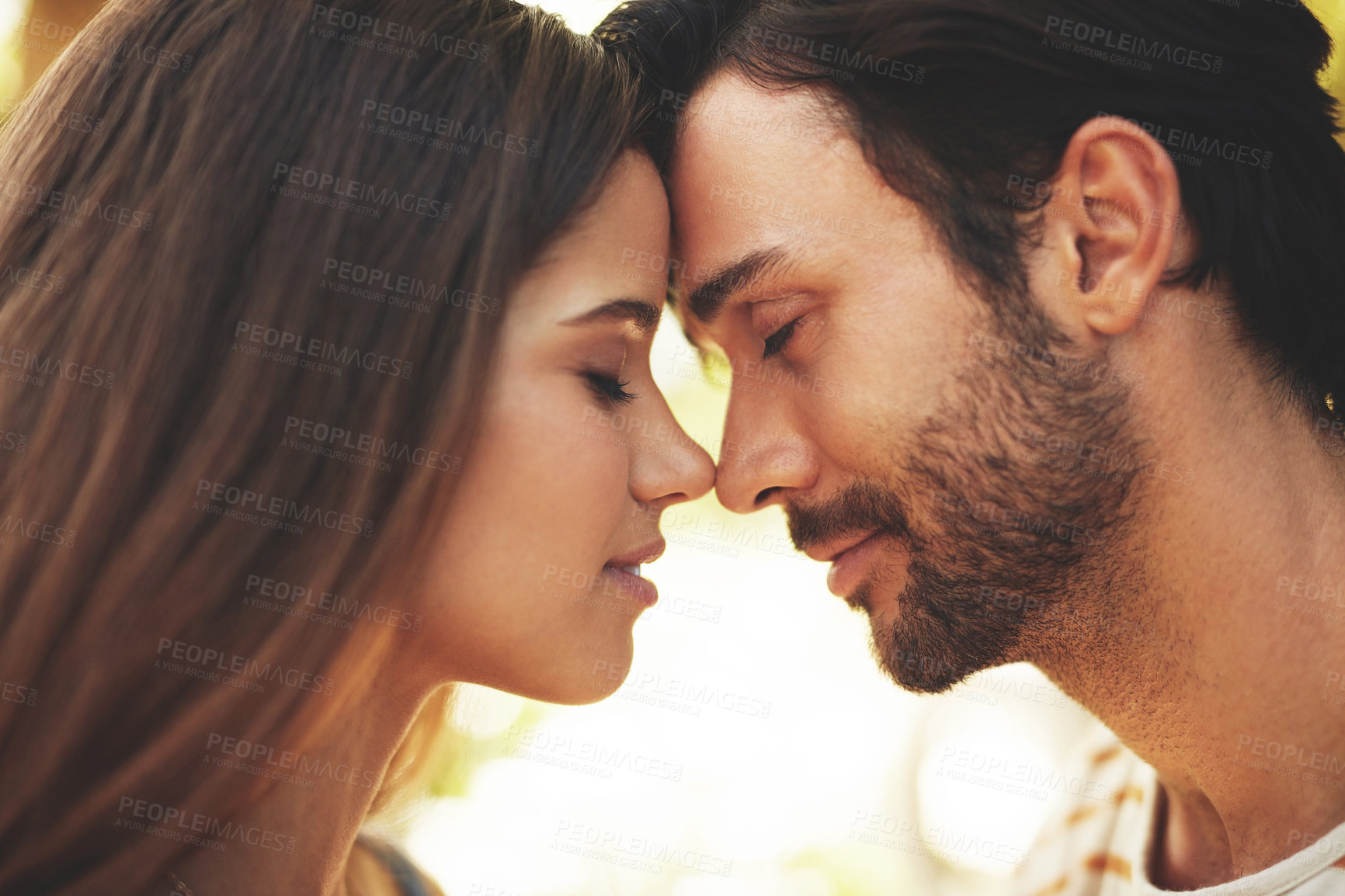 Buy stock photo Outdoor, couple and smile with forehead touch in park for bonding, love and affection in Spain. People, relationship and eyes closed for support with care as lovers on break to relax, rest and trust