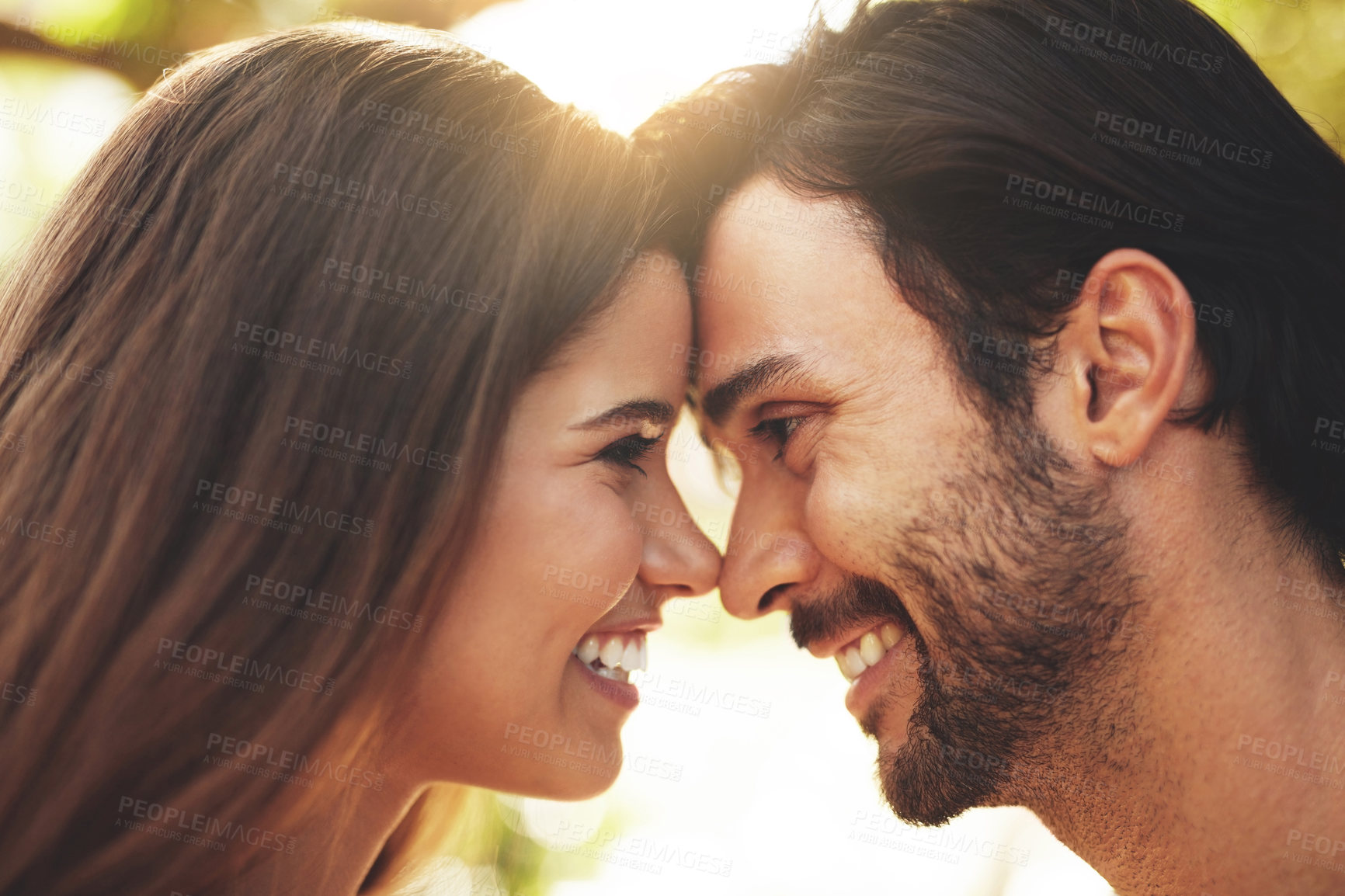 Buy stock photo Park, couple and smile with forehead touch in outdoor for bonding, love and affection in Spain. People, relationship and happy for support with care as lovers on break to relax, rest and embrace