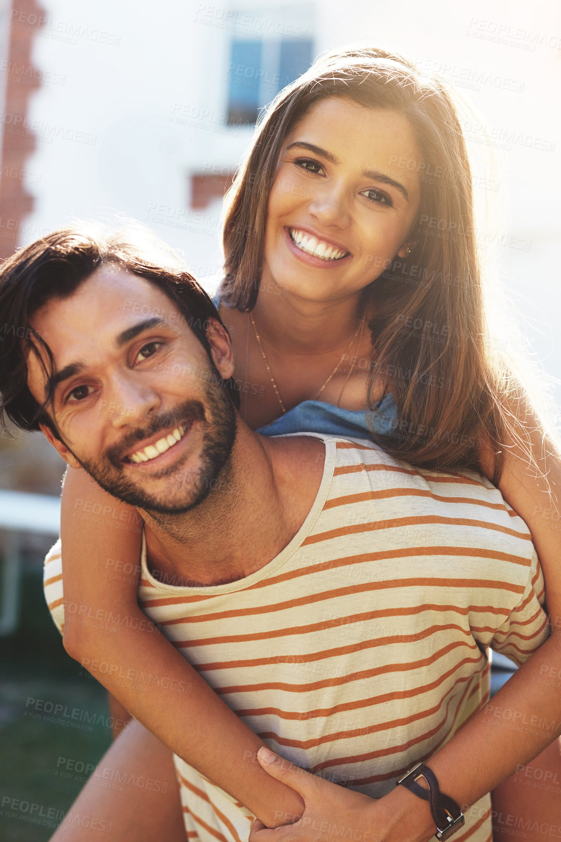 Buy stock photo Couple, piggy back and smile in portrait with sunshine, bonding and connection on vacation with care. Man, woman and happy with carrying, hug and love in summer for play in backyard garden on lawn