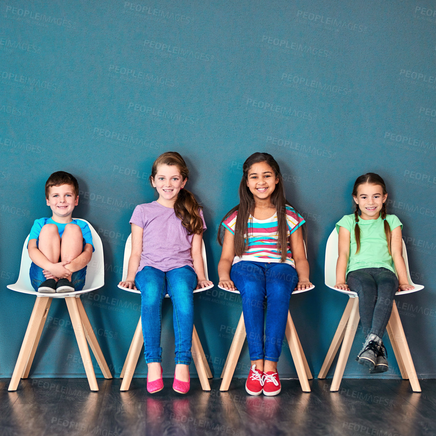 Buy stock photo Children, chair and row with portrait in studio for knowledge, development or learning in school. Happy, students and kids with smile at academy for education, scholarship or academic growth together