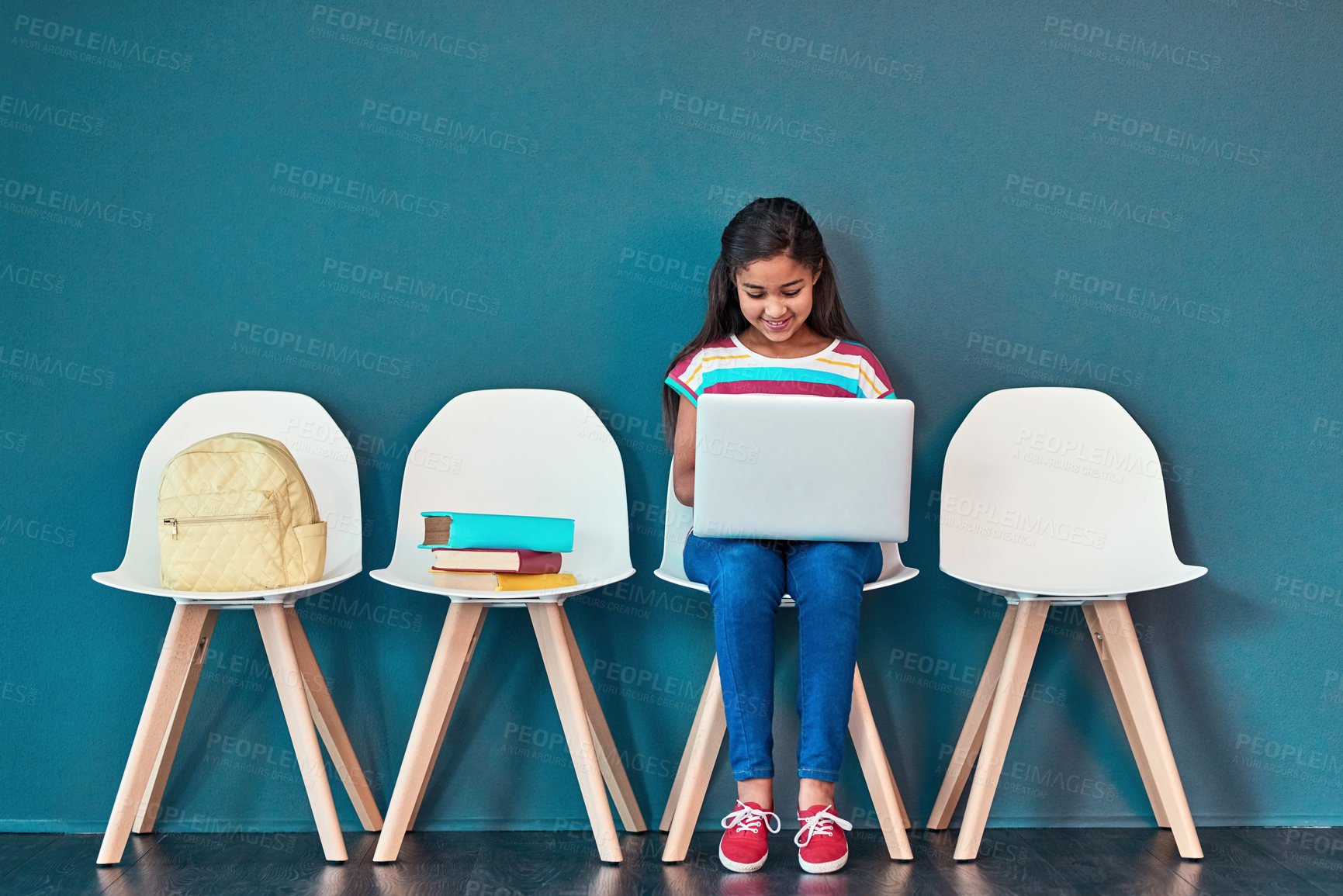 Buy stock photo Education, entrance exam and laptop with girl student in waiting room of school for academic interview. Chairs, children and computer with admission candidate getting ready for learning assessment