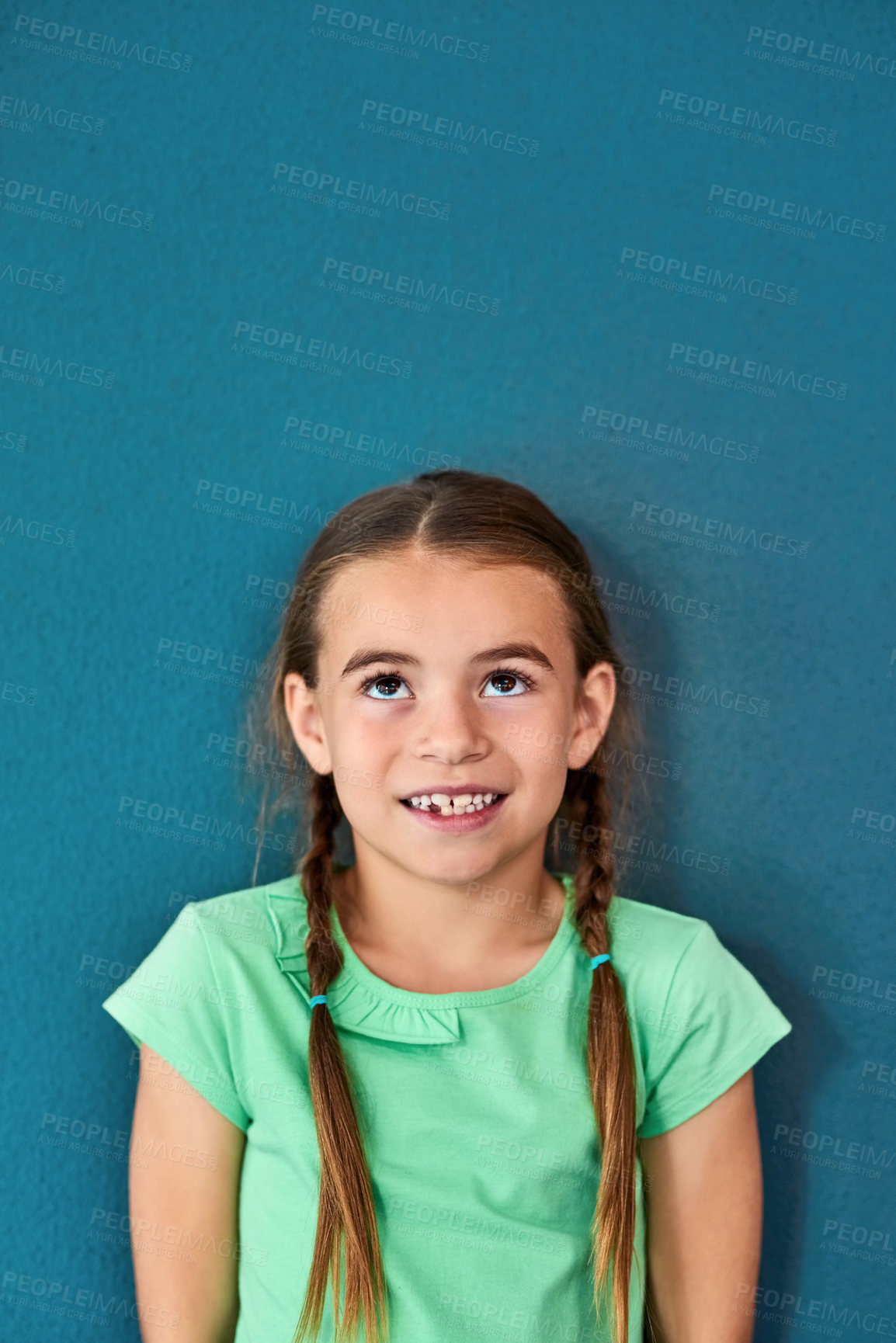 Buy stock photo Girl, child and happy with thinking on mockup with question, imagination and curiosity on blue background. Person, uncertain kid and thoughtful with wondering, daydreaming and contemplating on space