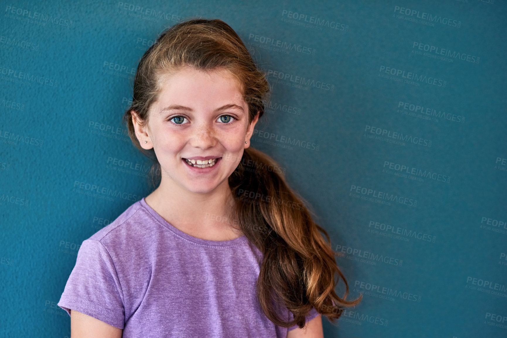 Buy stock photo Girl, kid and portrait with smile in studio, happiness for education in New York City. Female student, elementary grade and cheerful for knowledge in classroom, back to school on blue background