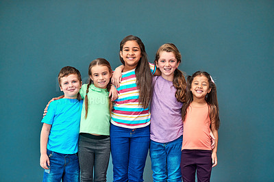 Buy stock photo Friends, happy and portrait of children in studio for back to school, education and academy. Students, youth and group of kids with smile for learning, scholarship and diversity on blue background