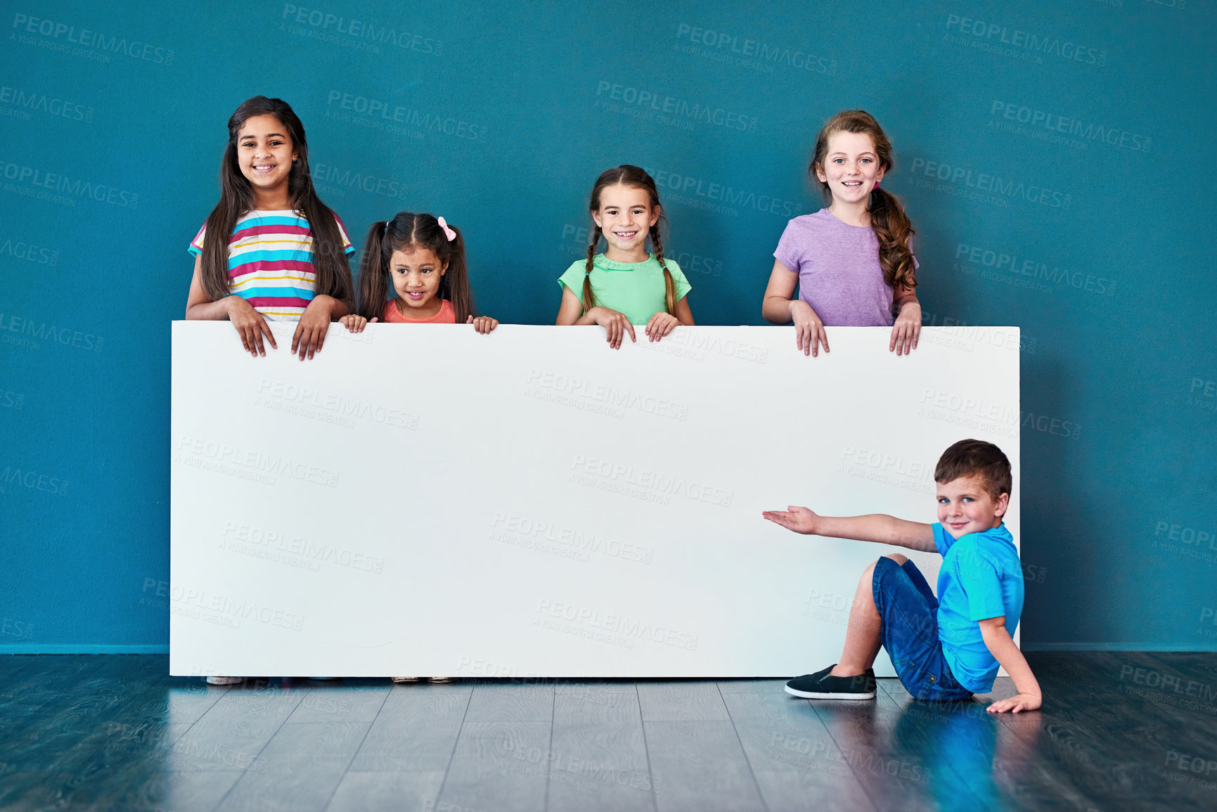 Buy stock photo Children, happy and portrait for placard, marketing and advertising discount with mockup space. People, smile and face on blue background for banner, branding and announcement with promo information