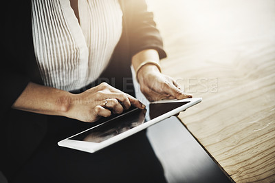Buy stock photo Closeup shot of a businesswoman using a digital tablet in an office