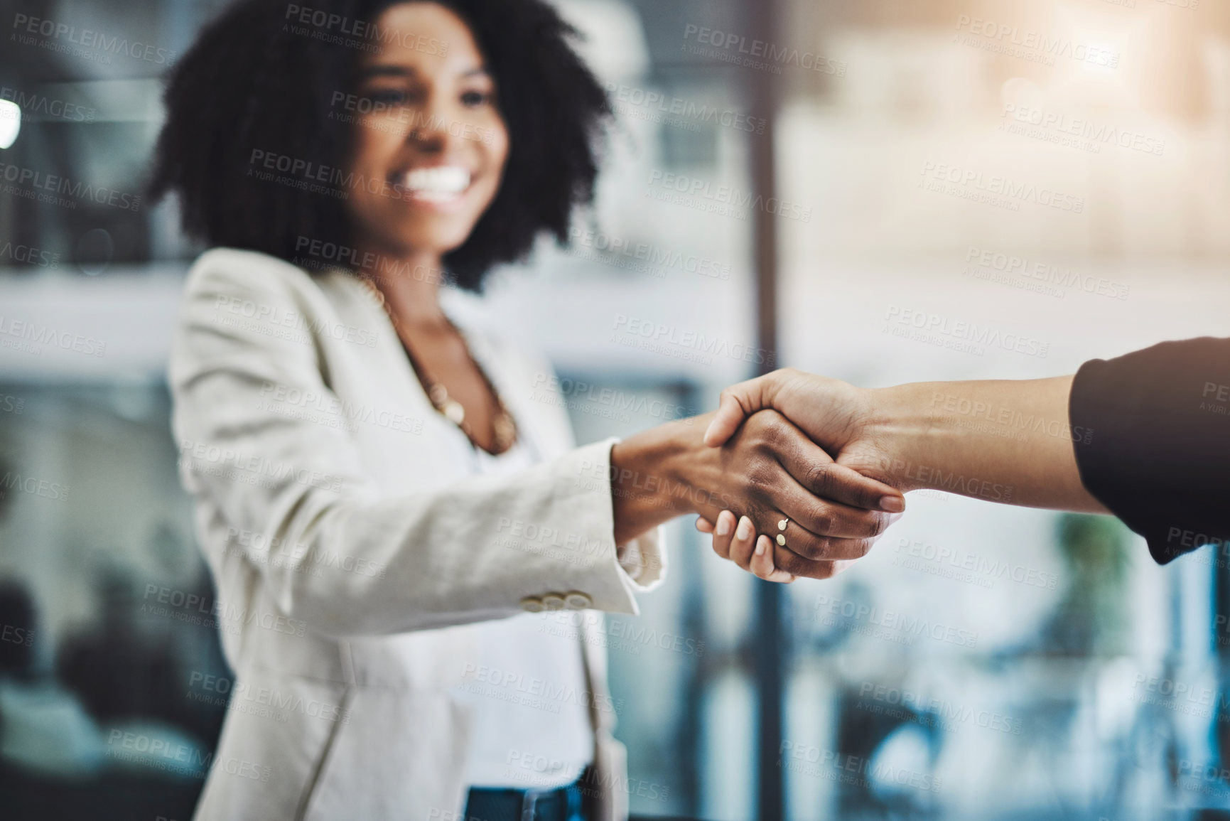 Buy stock photo Closeup shot of two businesswomen shaking hands in an office