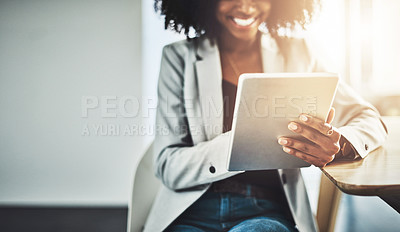 Buy stock photo Closeup shot of a businesswoman using a digital tablet in an office