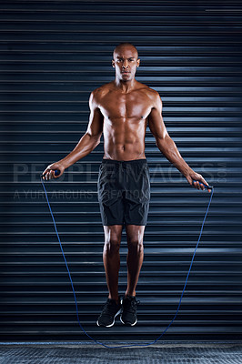 Buy stock photo Fitness, black man and portrait with skipping rope for workout, cardio and body training. Health, performance and energy of exercise person with muscle jumping for cardiovascular wellness.