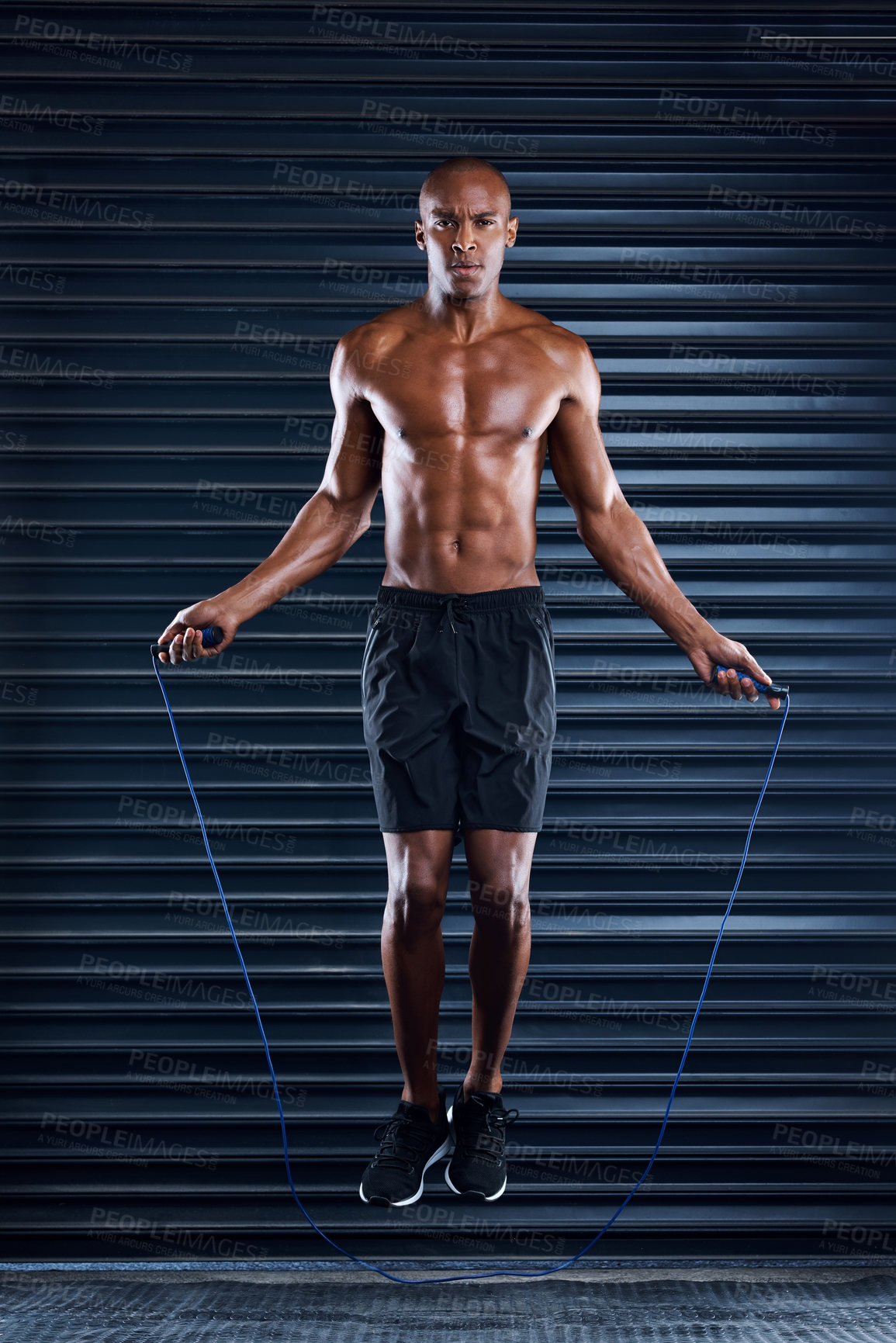Buy stock photo Fitness, black man and portrait with skipping rope for workout, cardio and body training. Health, performance and energy of exercise person with muscle jumping for cardiovascular wellness.