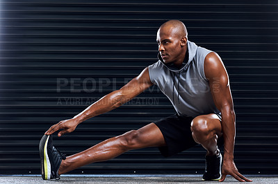 Buy stock photo Male athlete, workout and stretching leg with hand for sports, exercise and fitness in gym. Healthy man, challenge and cardio routine for wellness, muscle and strength training for physical activity