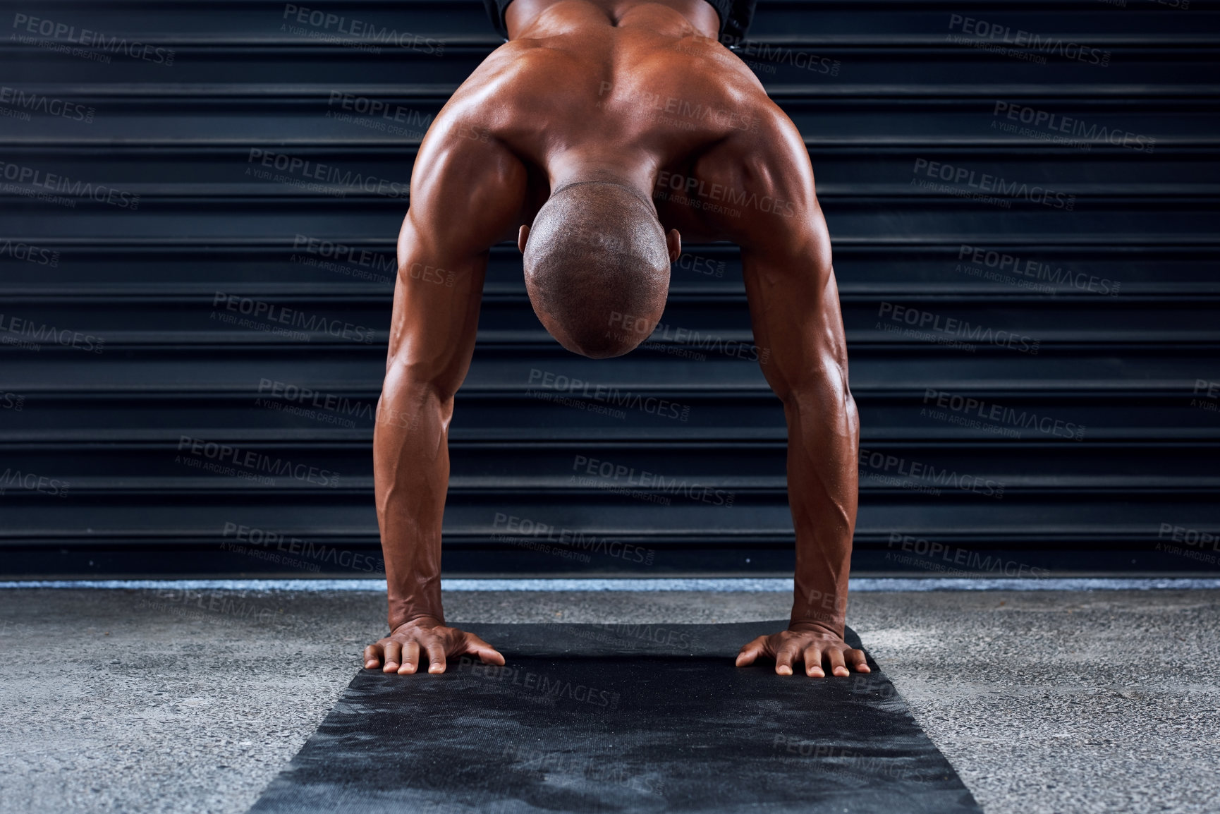 Buy stock photo Shot of a sporty young man doing a handstand
