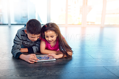 Buy stock photo Children, floor and tablet in house for elearning or play, education or development with technology. Boy, girl and electronics on ground in home for games, mobile app or family with wifi or happiness