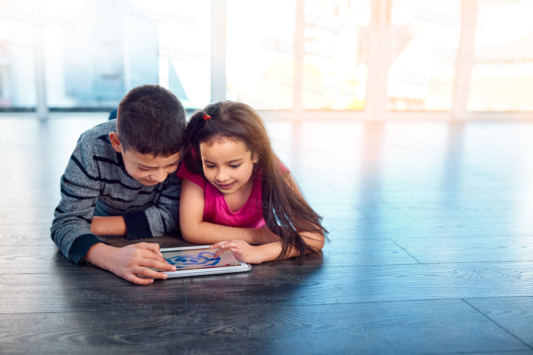 Buy stock photo Children, floor and tablet in house for elearning or play, education or development with technology. Boy, girl and electronics on ground in home for games, mobile app or family with wifi or happiness