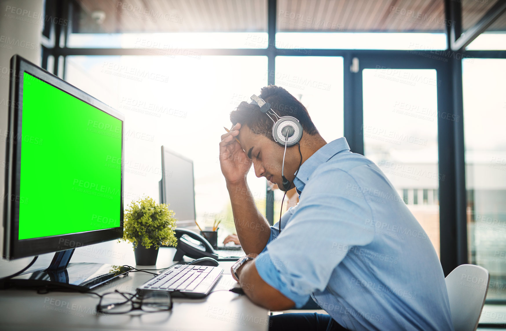 Buy stock photo Businessman, call center and headache with green screen computer in burnout, stress or overworked at office. Man consultant agent with bad head pain or anxiety with mockup chromakey at workplace